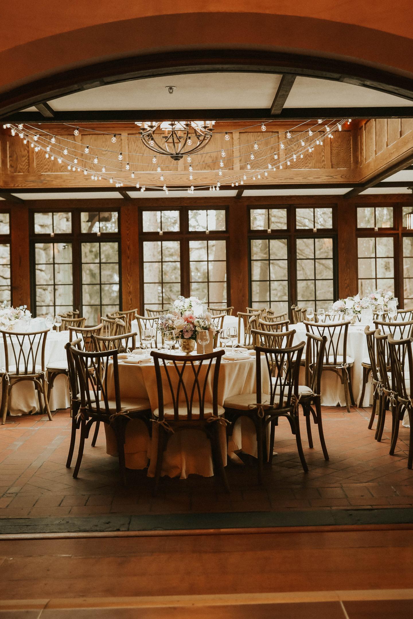 A conservatory set up for a wedding reception