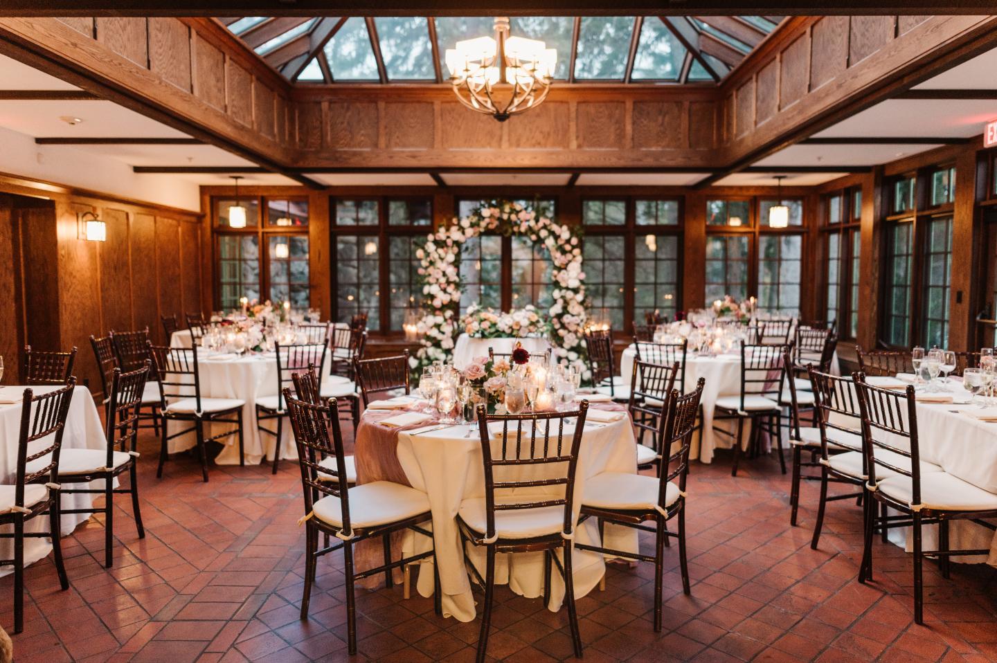 A conservatory set up for a wedding reception