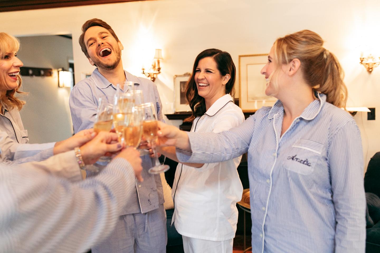 A bridal party cheersing champagne