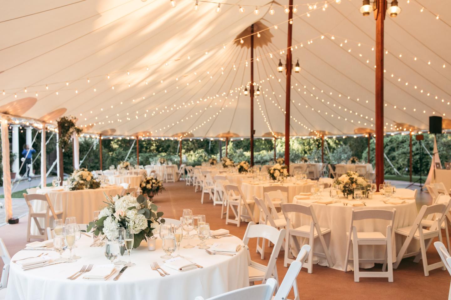 A tent set up for a wedding reception