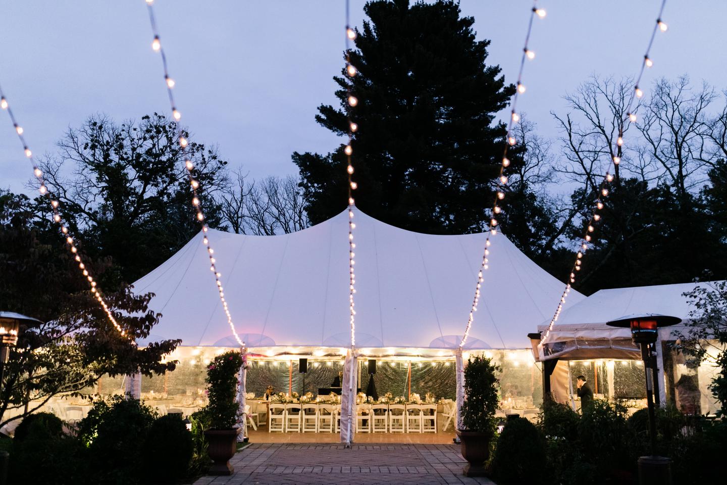 A tent set up for a wedding reception