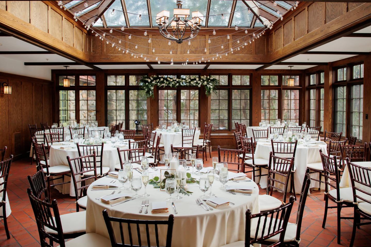 A conservatory set up for a wedding reception