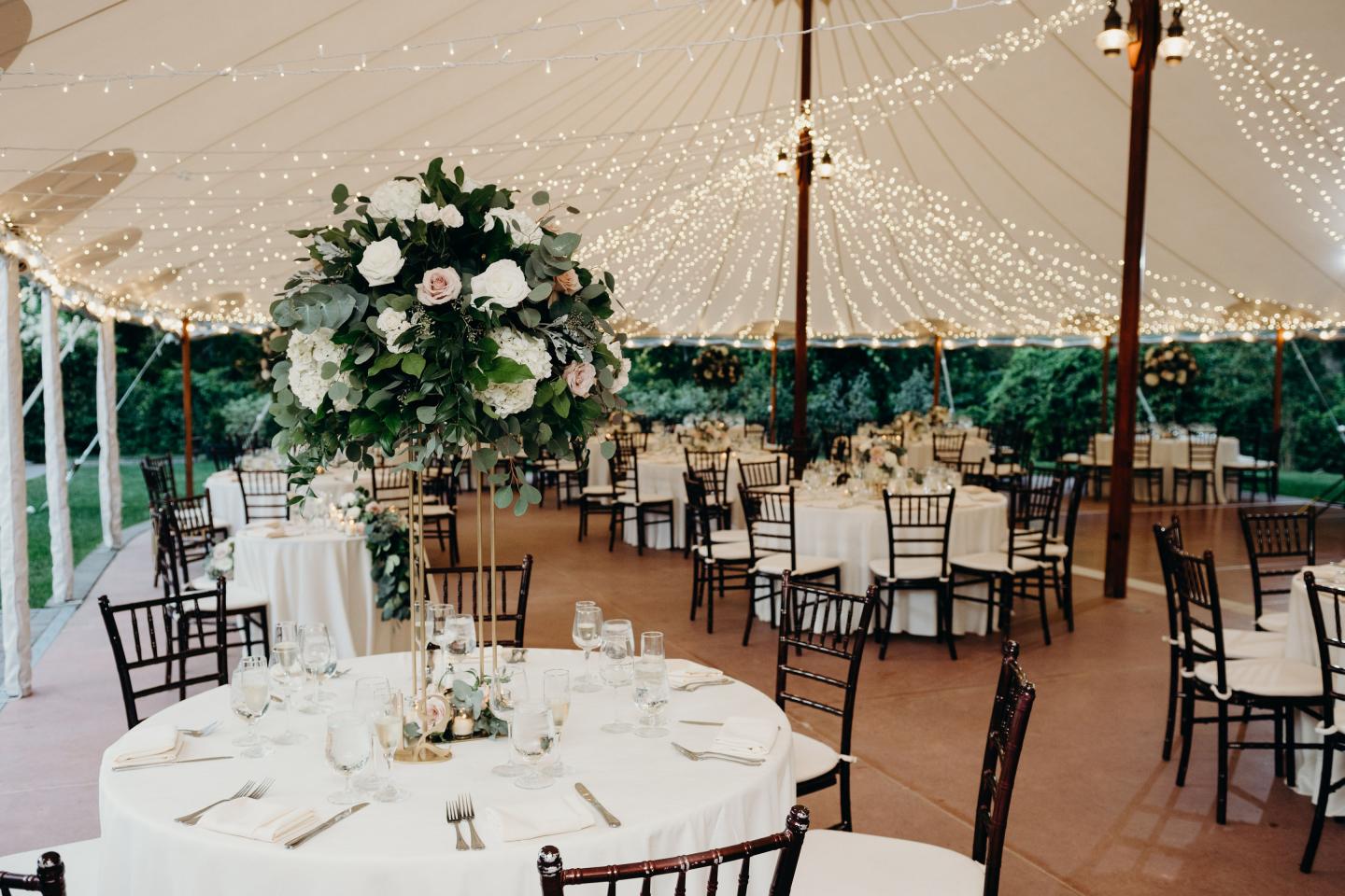 A tent set up for a wedding reception