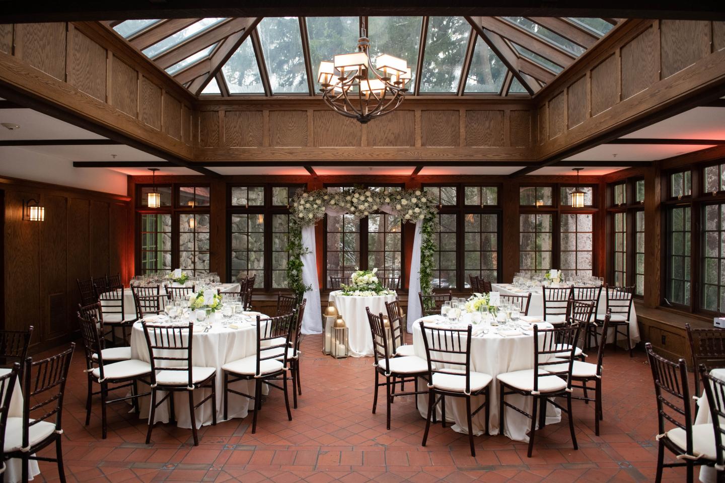 A conservatory set up for a wedding reception