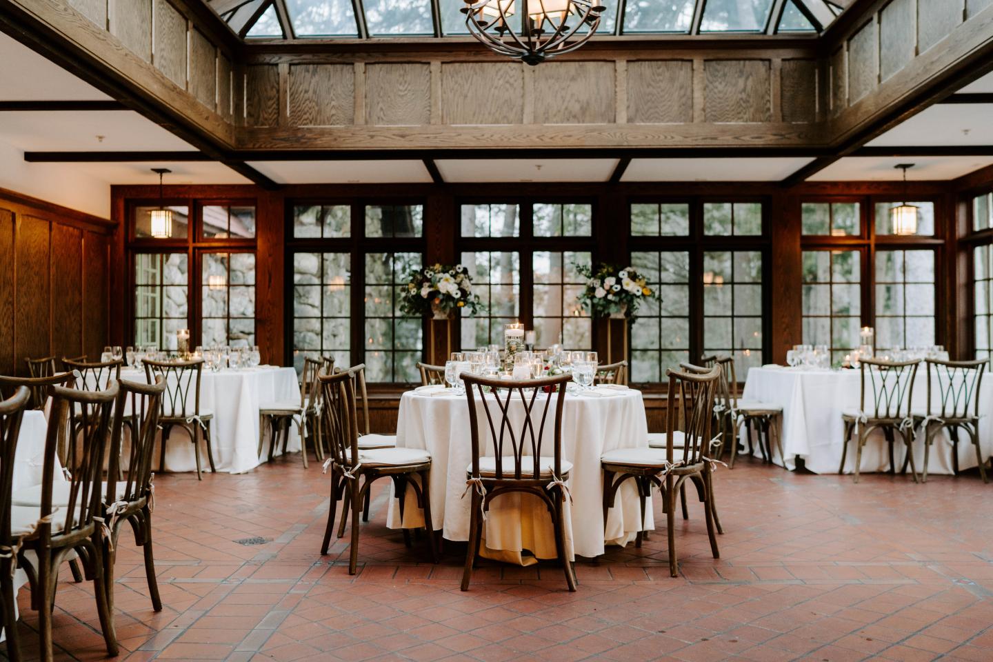 A conservatory set up for a wedding reception