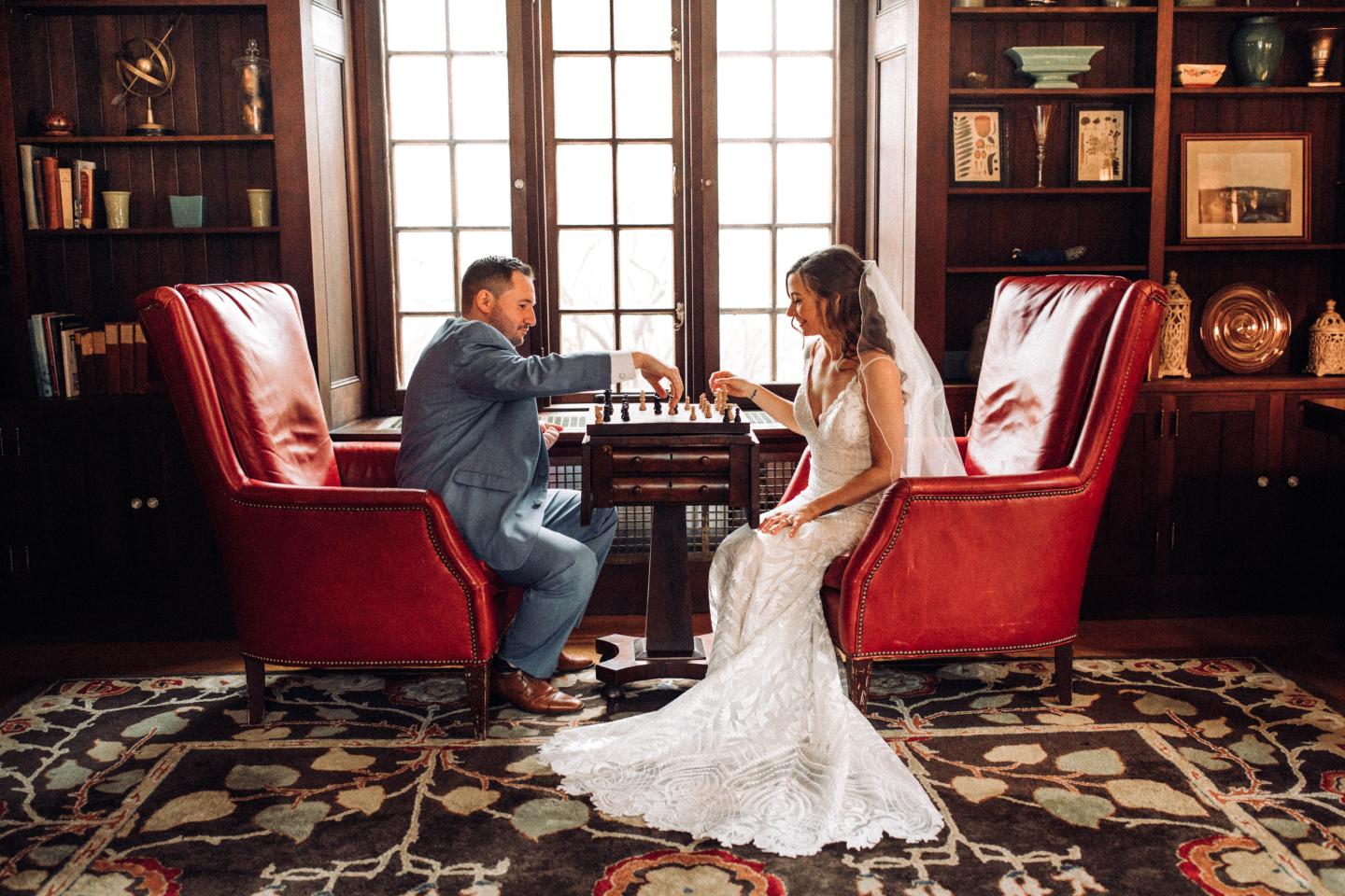 A bride and groom playing chess