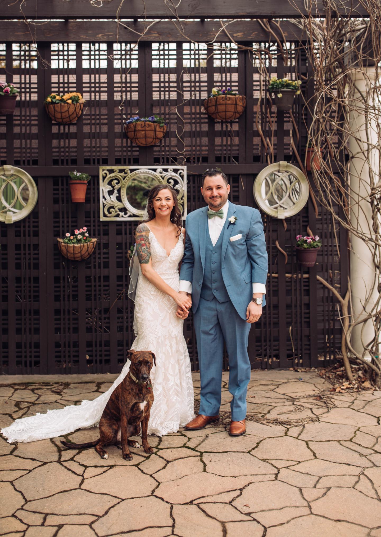 A bride and groom and their dog
