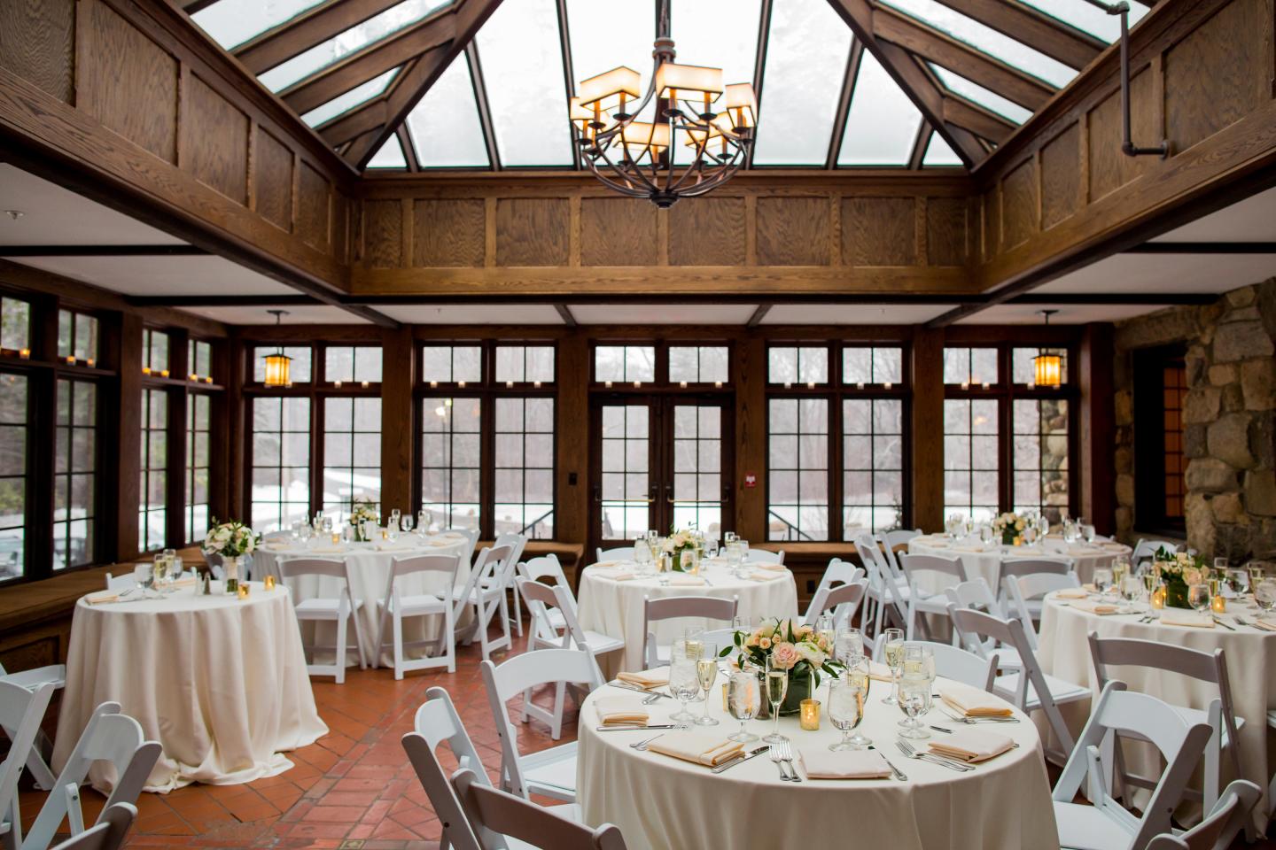 A conservatory set up for a wedding reception