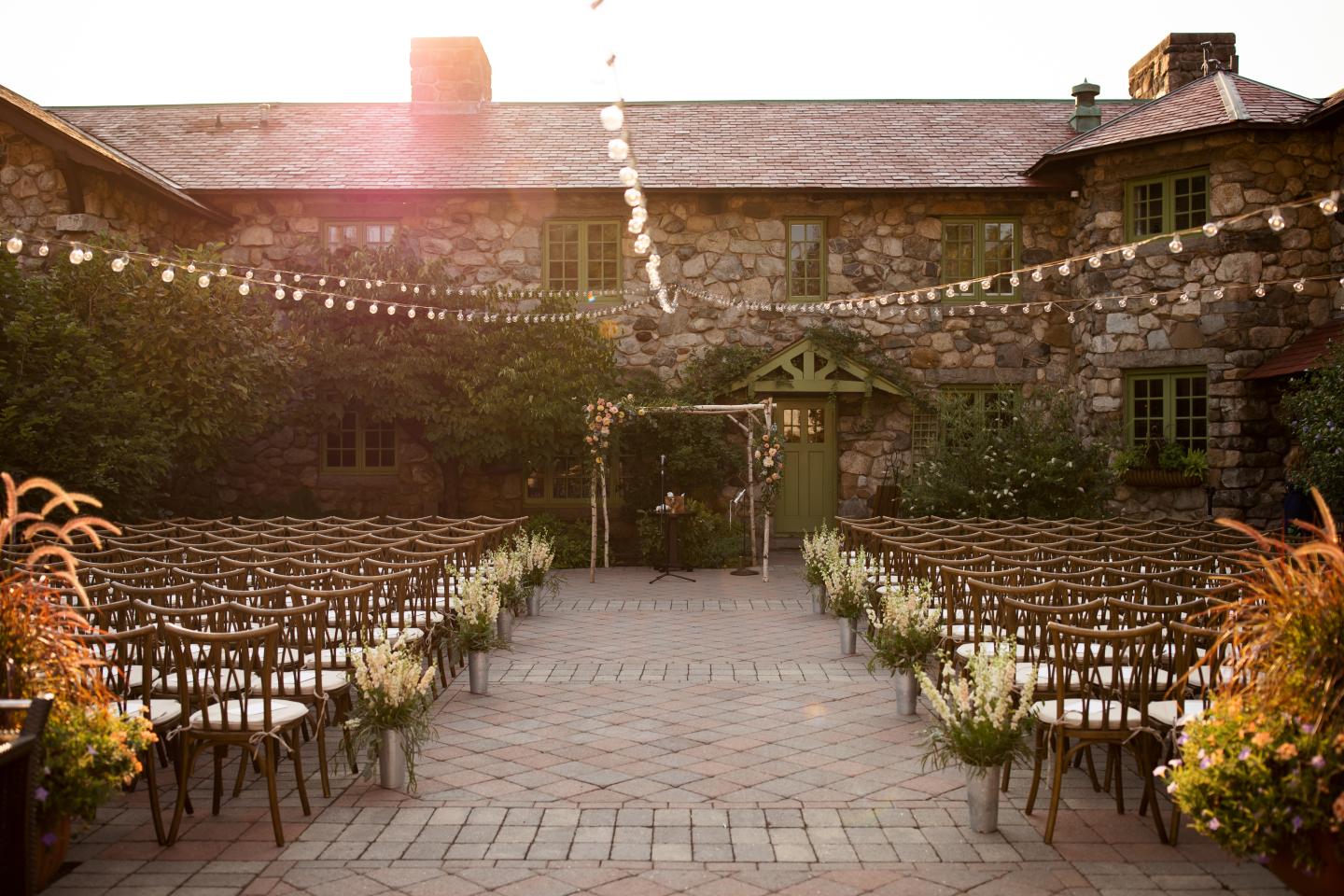 A courtyard set up for a wedding ceremony