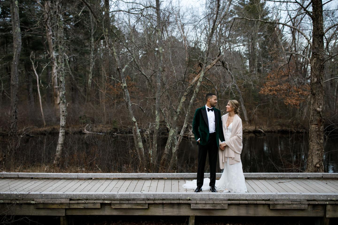 A bride and groom on a boardwalk