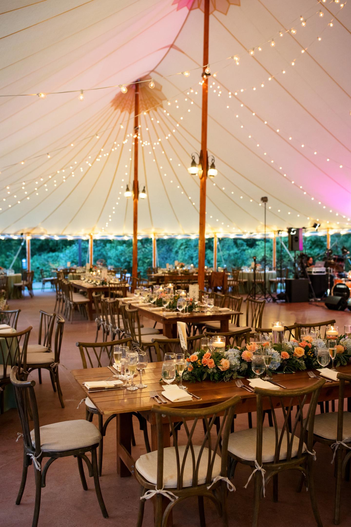 A tent set up for a wedding reception
