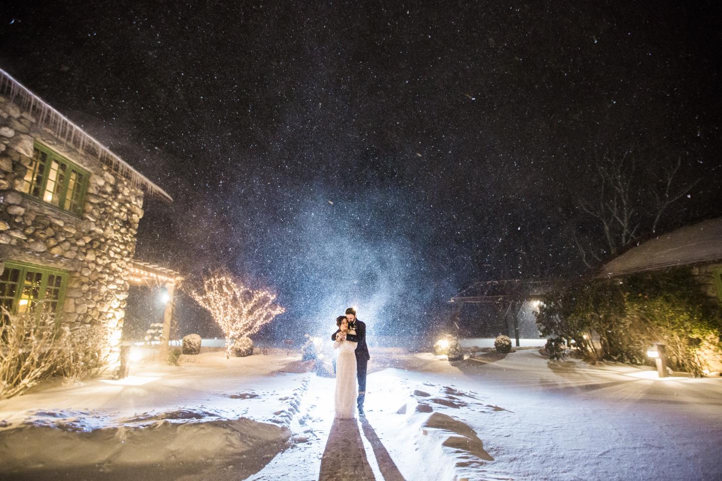 A bride and groom in the snow