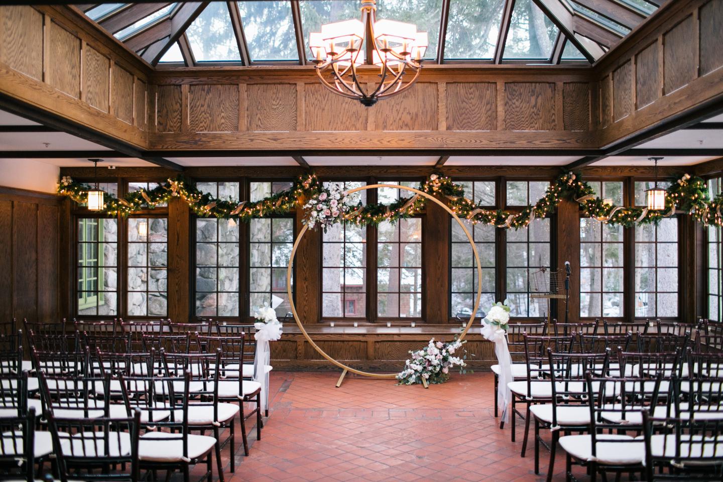 A conservatory set up for a wedding ceremony