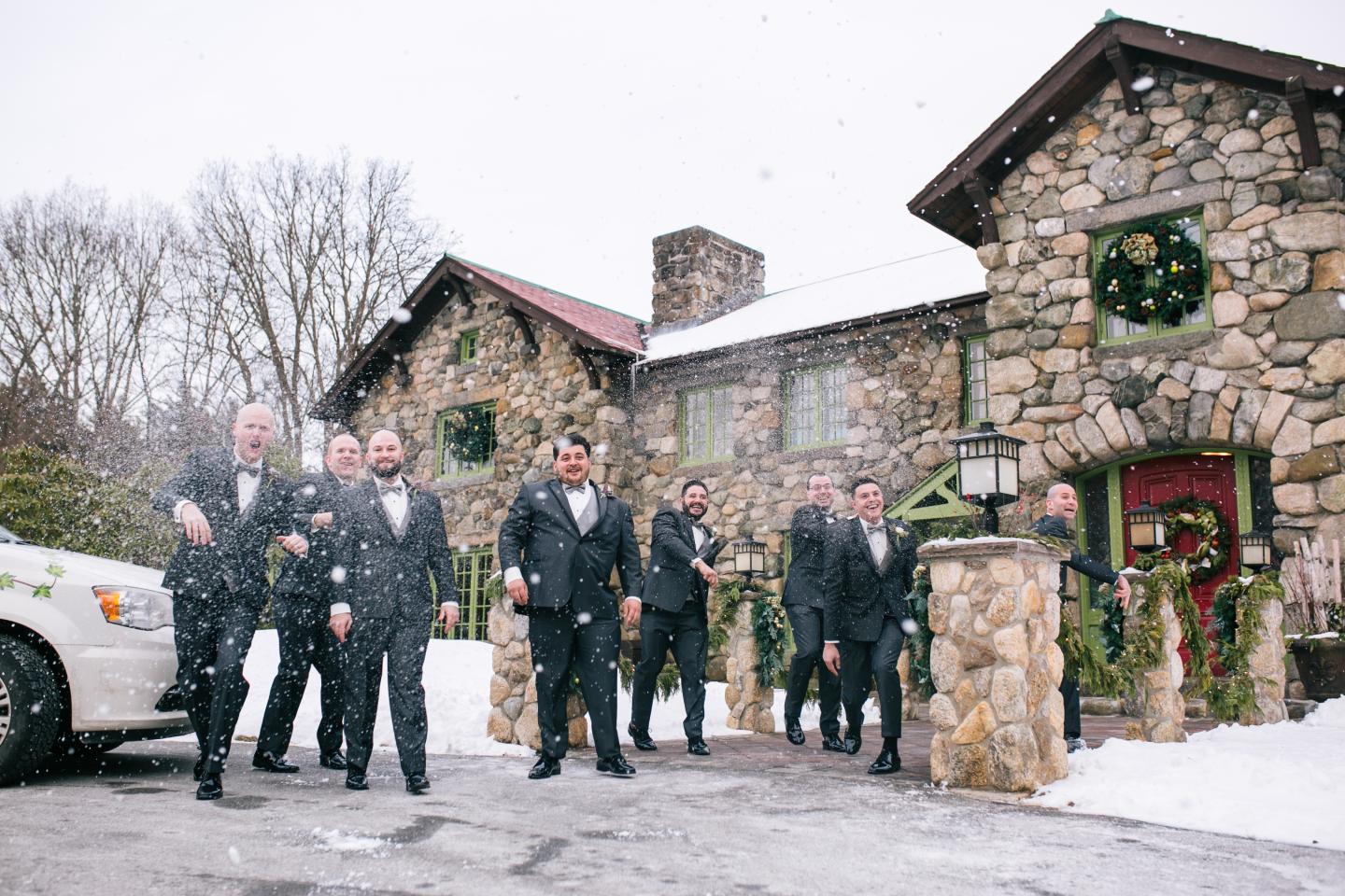 Groomsmen throwing snowballs