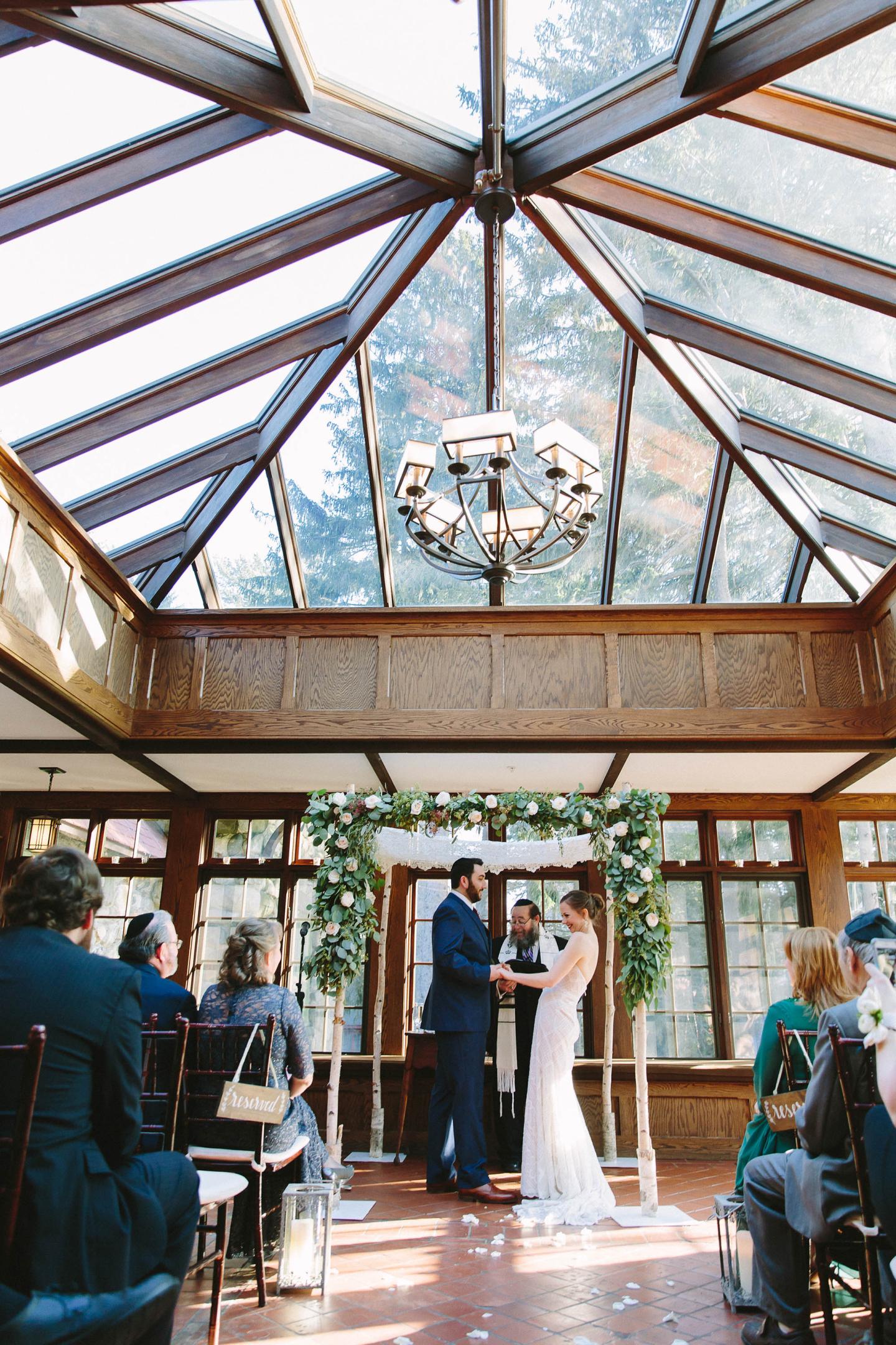A wedding ceremony in a conservatory