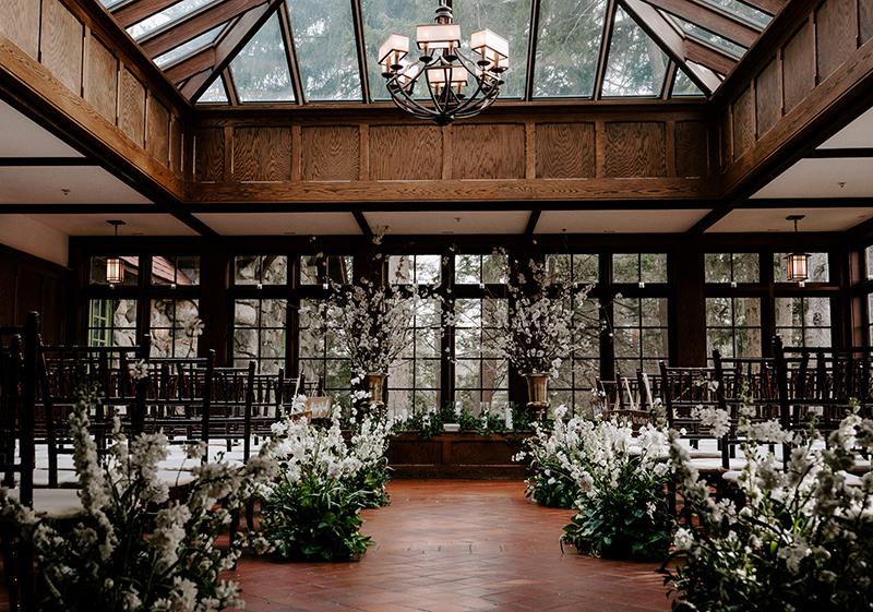 A conservatory set up for a wedding ceremony