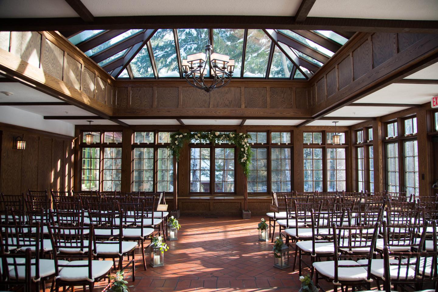 A conservatory set up for a wedding ceremony