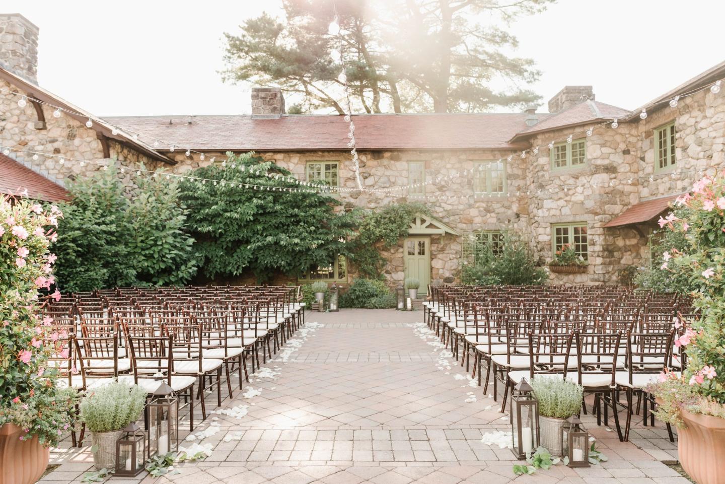 A courtyard set up for a wedding ceremony