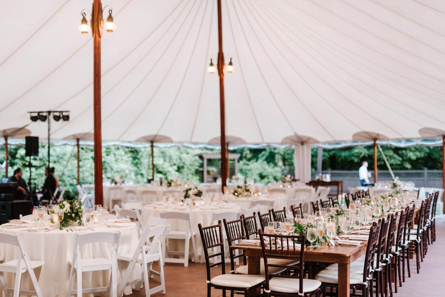 A tent set up for a wedding reception