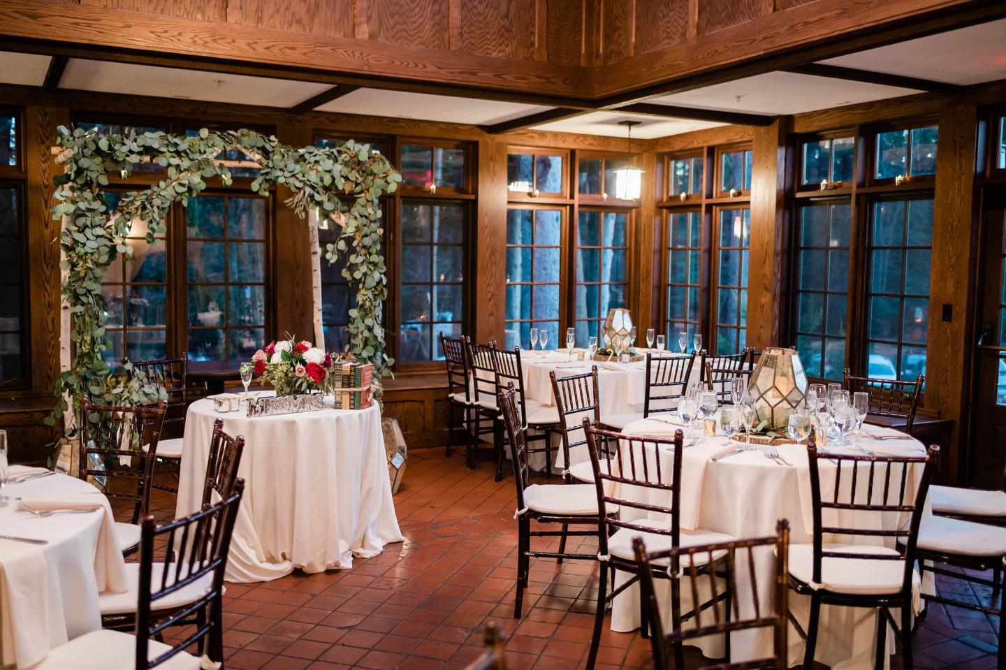A conservatory set up for a wedding reception