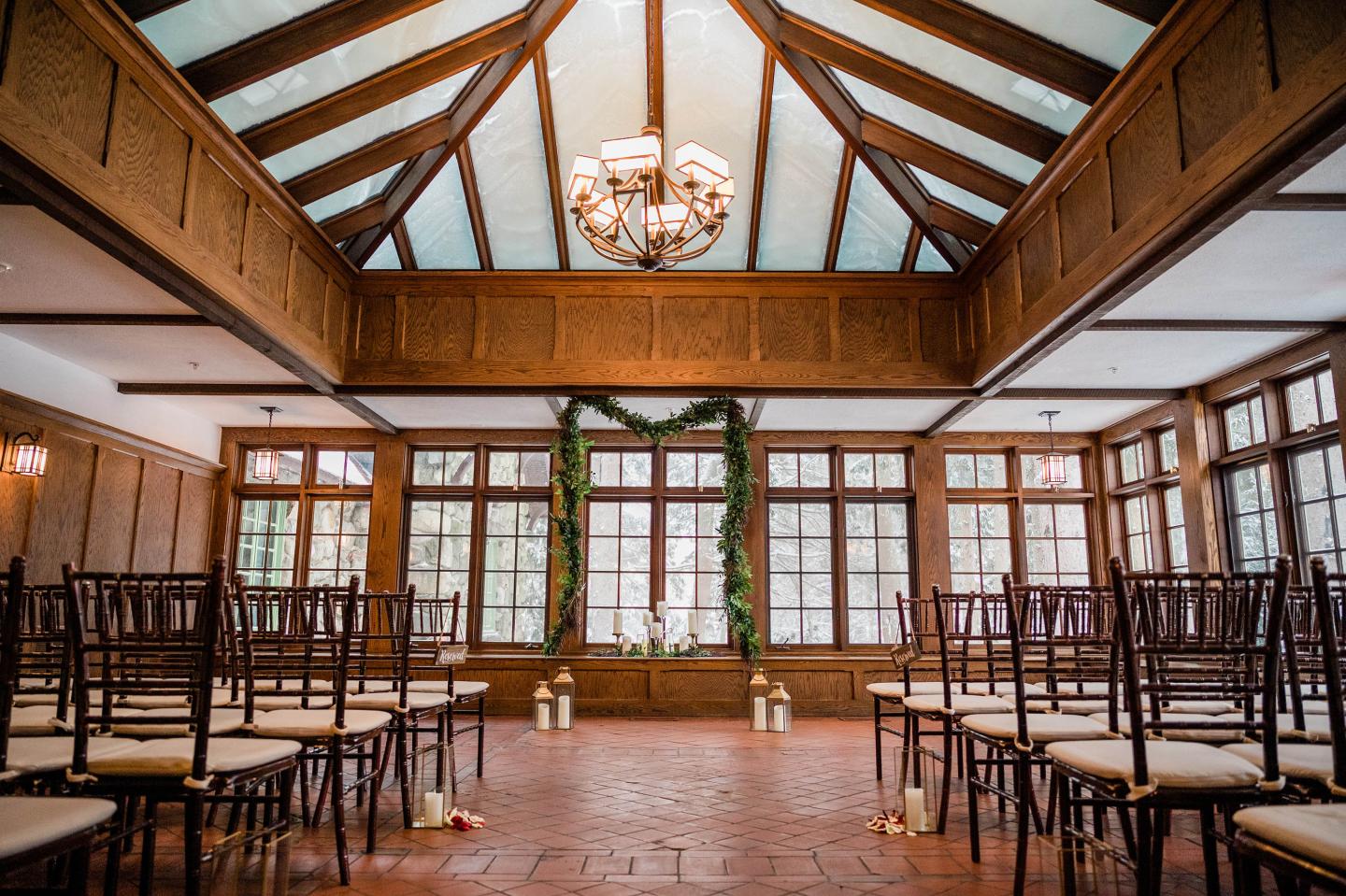 A conservatory set up for a wedding ceremony