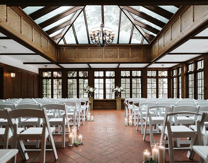 A conservatory set up for a wedding ceremony