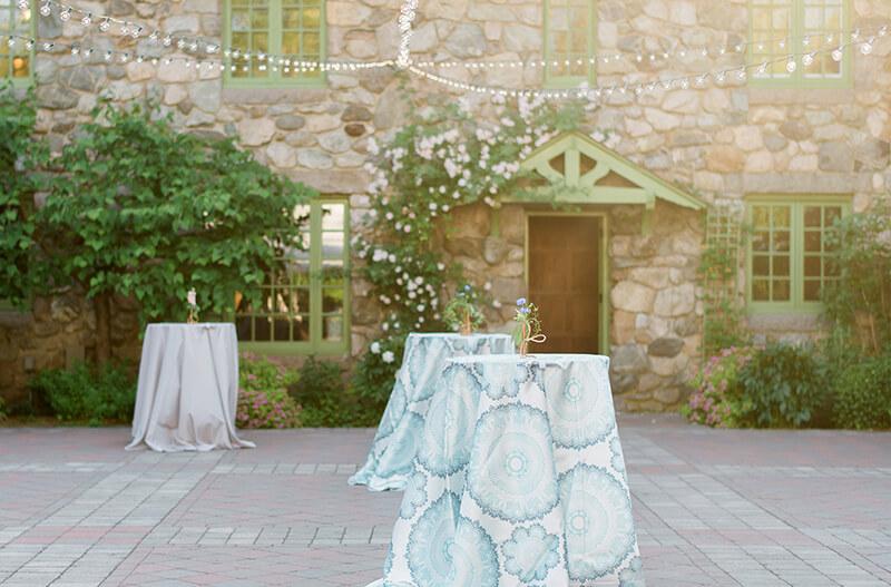 A courtyard set up with standing tables