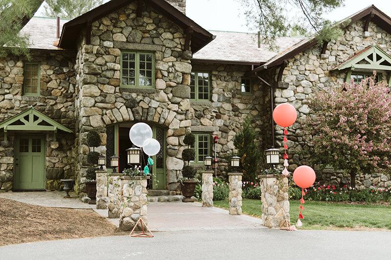 Balloons outside a mansion