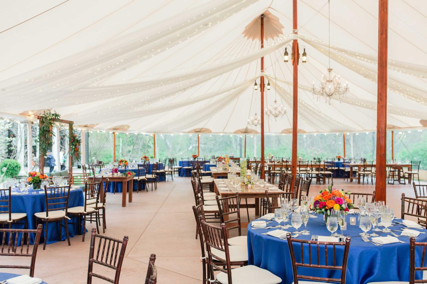 A tent set up for a wedding reception