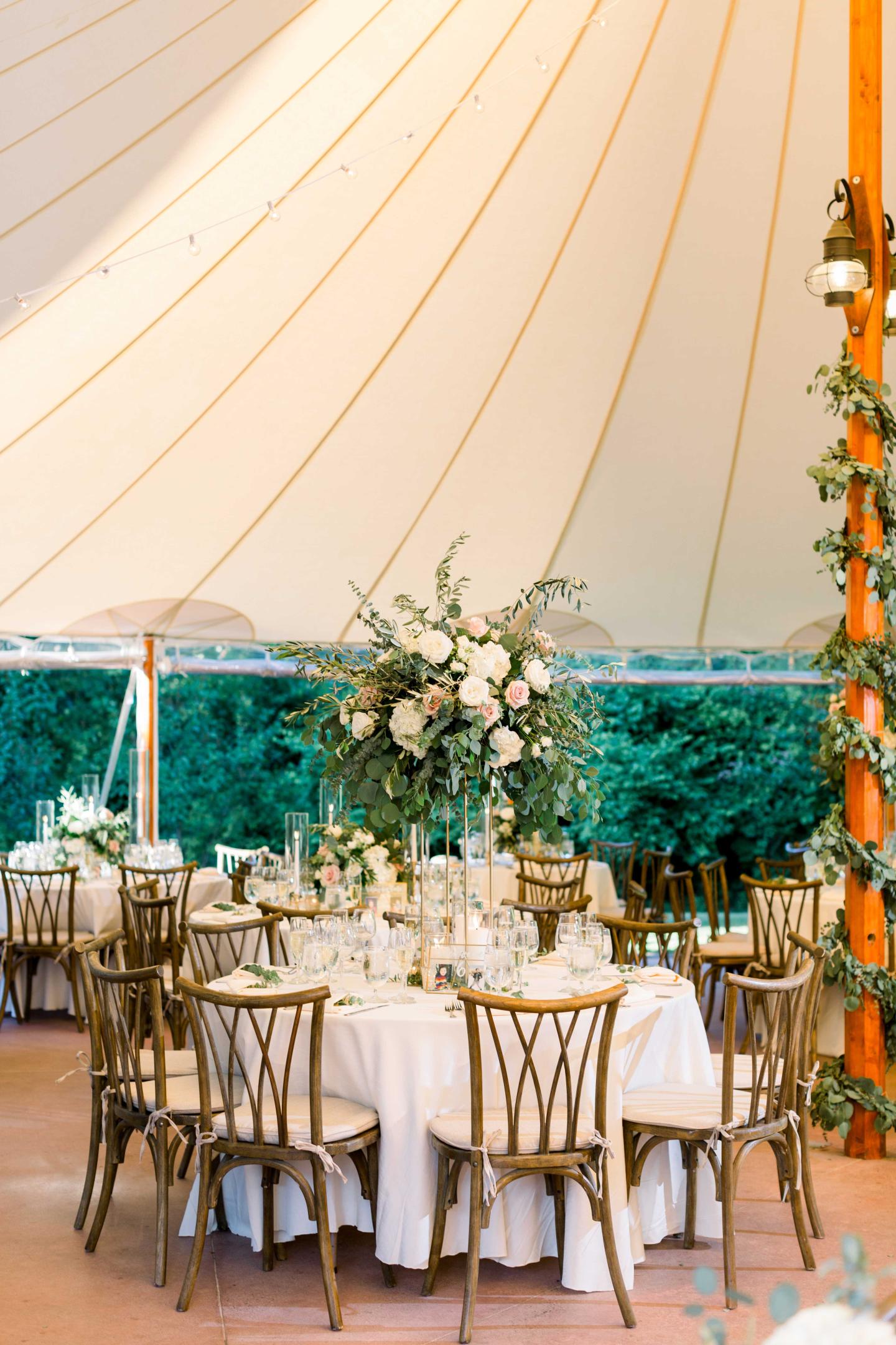 A tent set up for a wedding reception