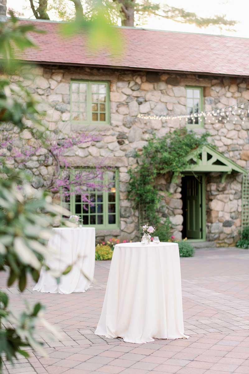 A courtyard with standing tables