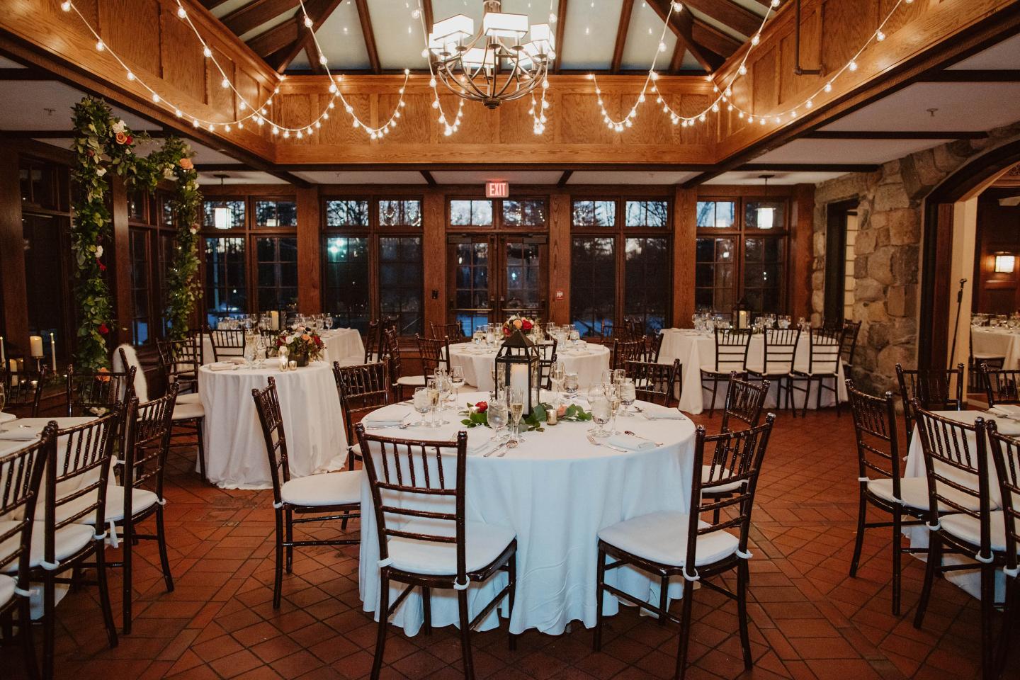 A conservatory set up for a wedding reception