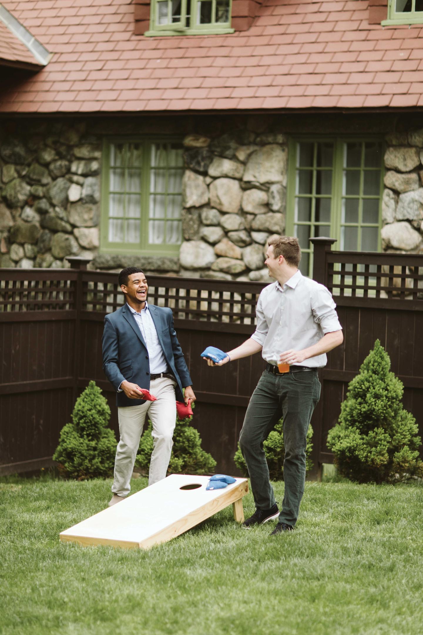people playing cornhole