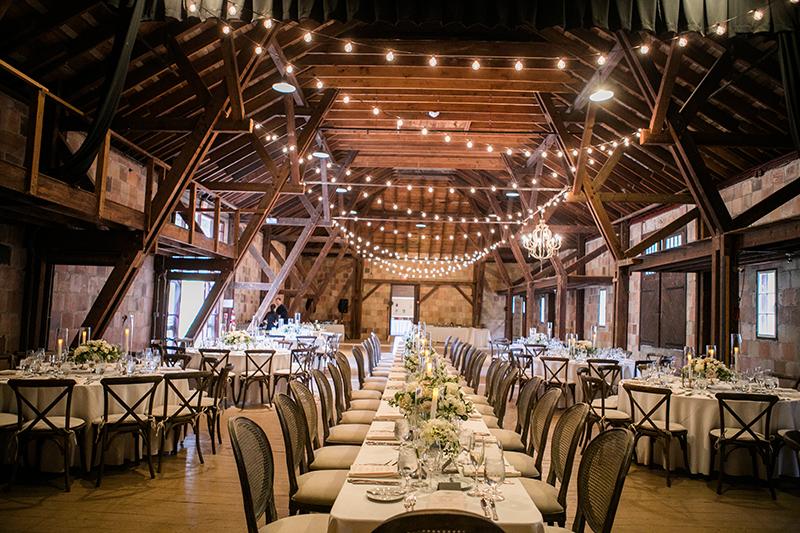 A hall set up for a wedding reception