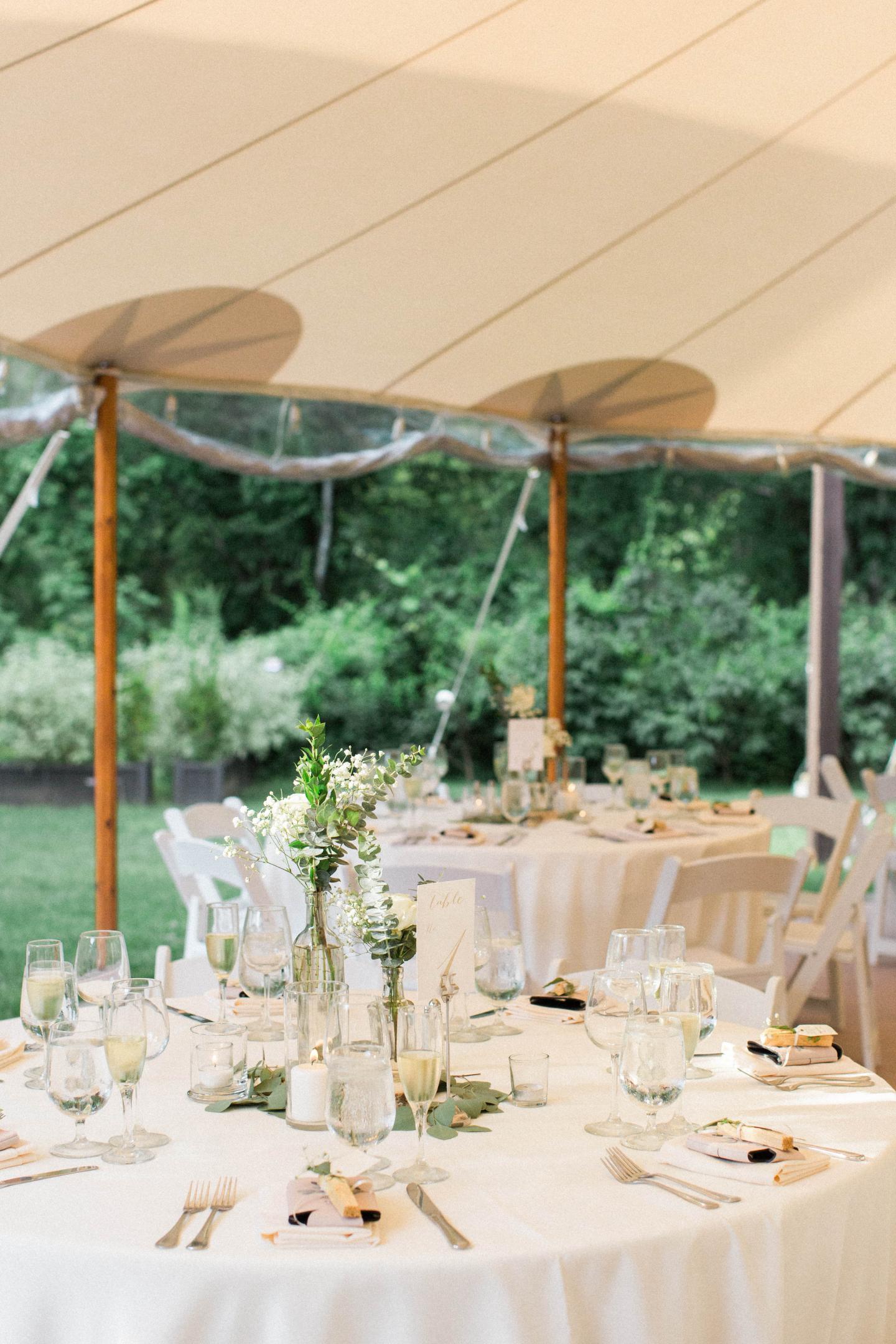 A tent set up for a wedding reception