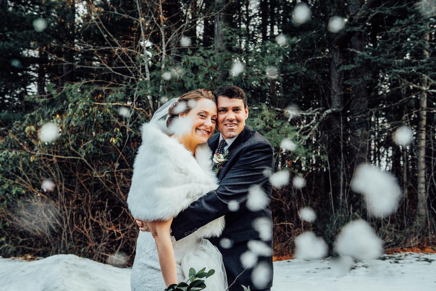 A bride and groom in the snow