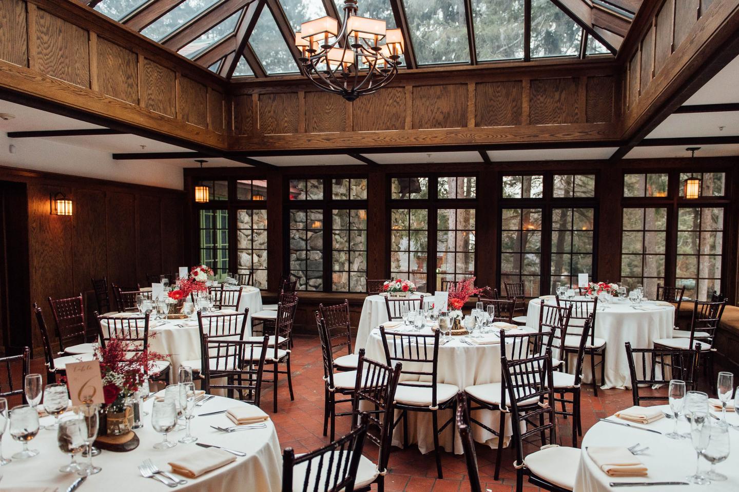 A conservatory set up for a wedding reception