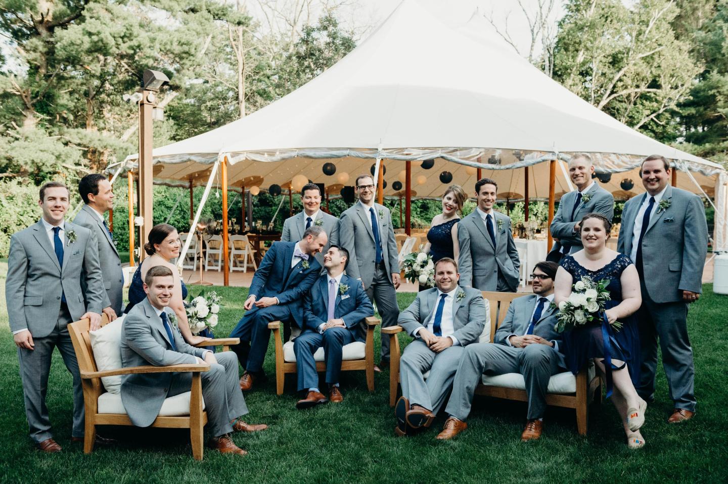 Bridesmaids and groomsmen posing for a photo