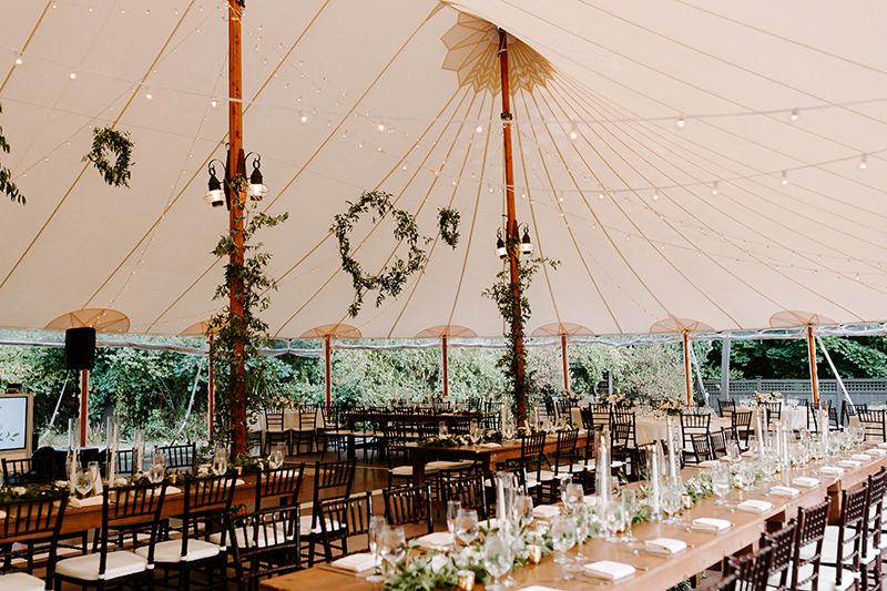 A wedding reception setting in a marquee