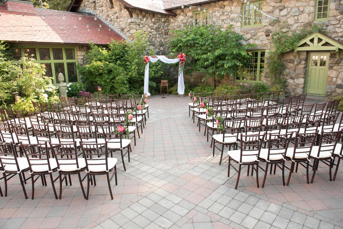 A courtyard set up for a wedding ceremony