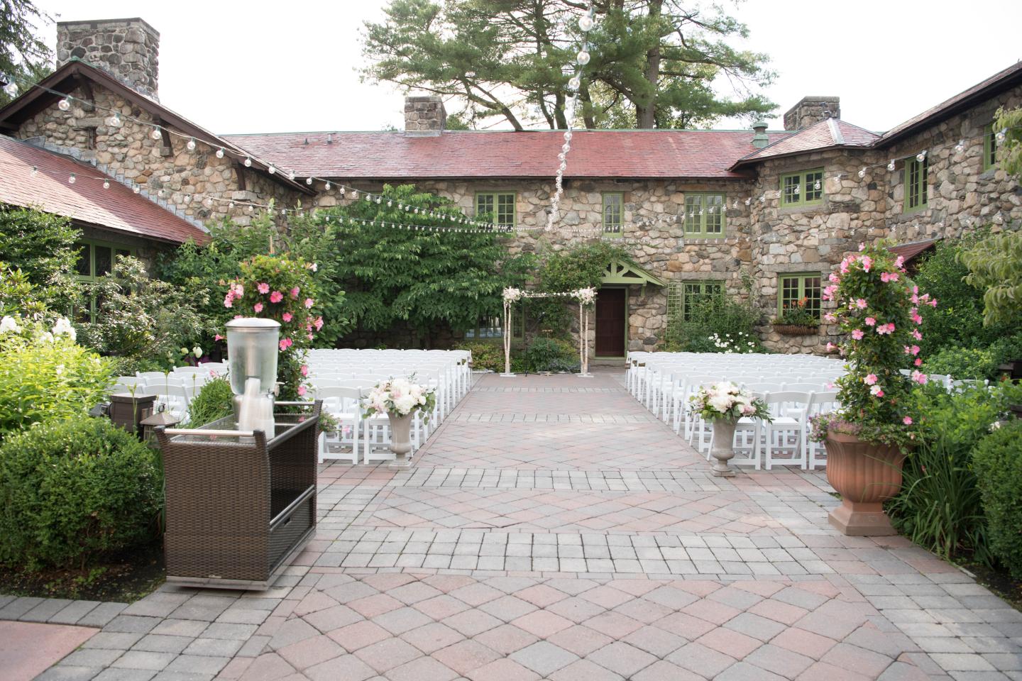 A courtyard set up for a wedding ceremony