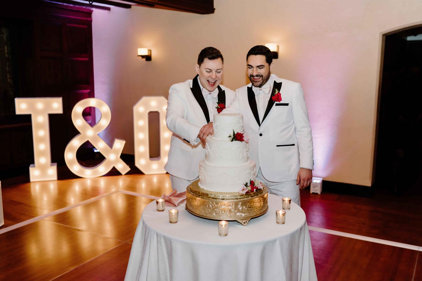 Couple cutting cake