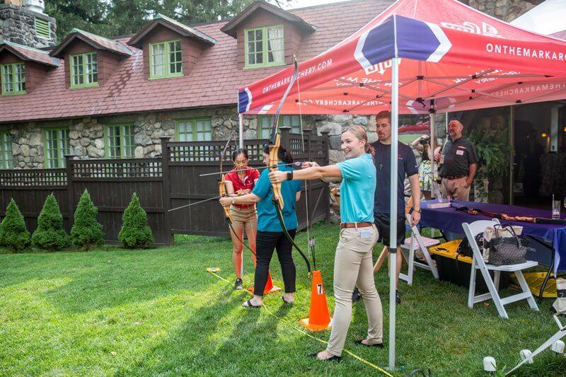 People using bows and arrows