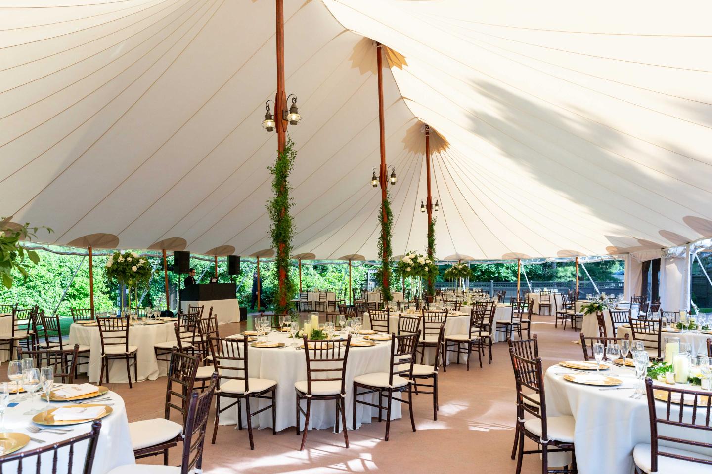 A tent set up for a wedding reception