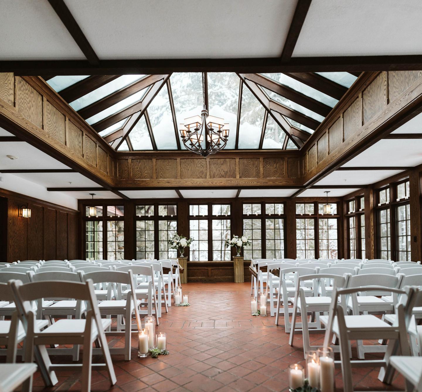 A conservatory set up for a wedding ceremony