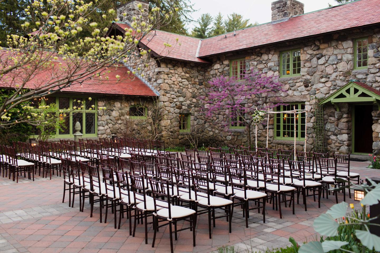 A courtyard set up for a wedding ceremony