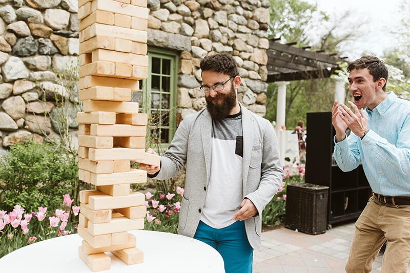 Two people playing giant jenga