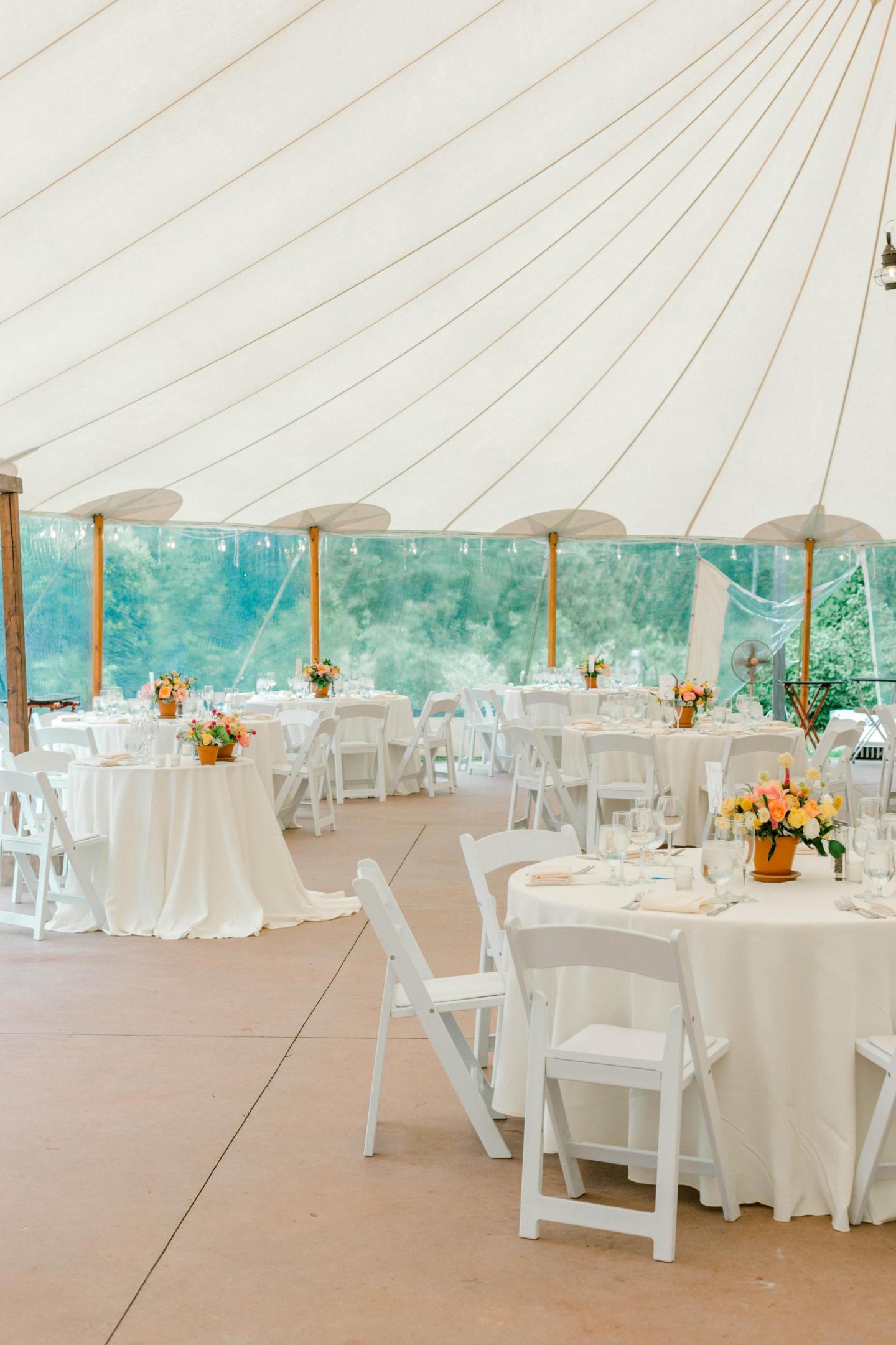 A tent set up for a wedding reception