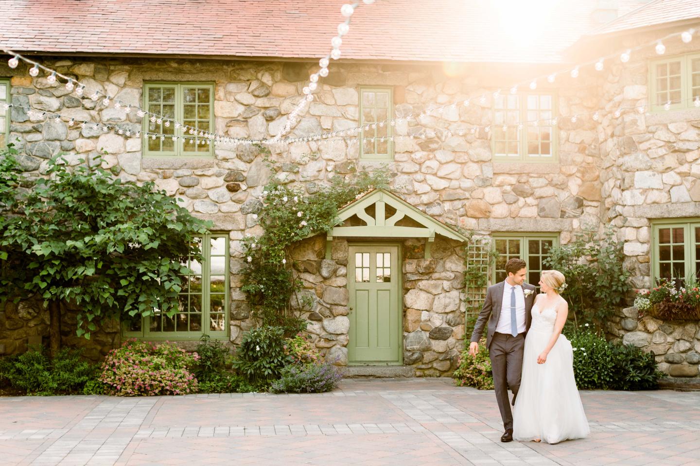 A bride and groom in a courtyard