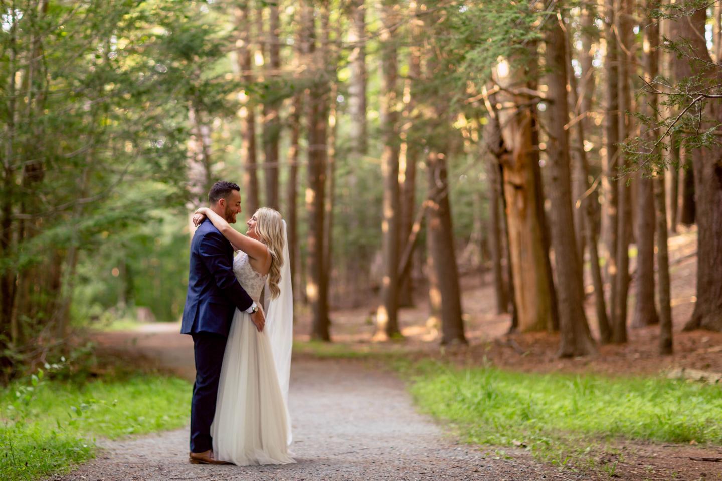 A bride and groom in a forest